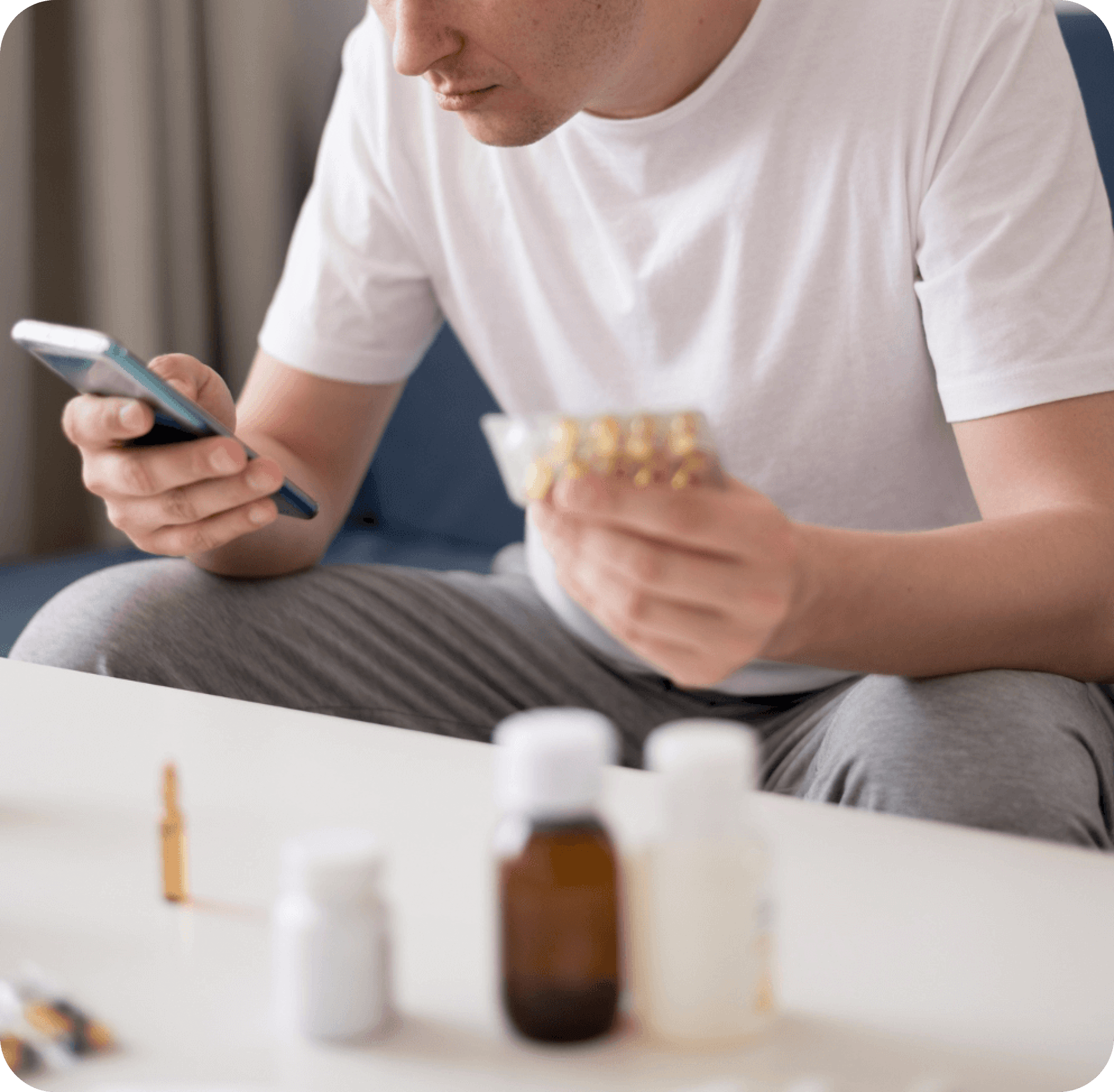 man looking at med coupons on phone