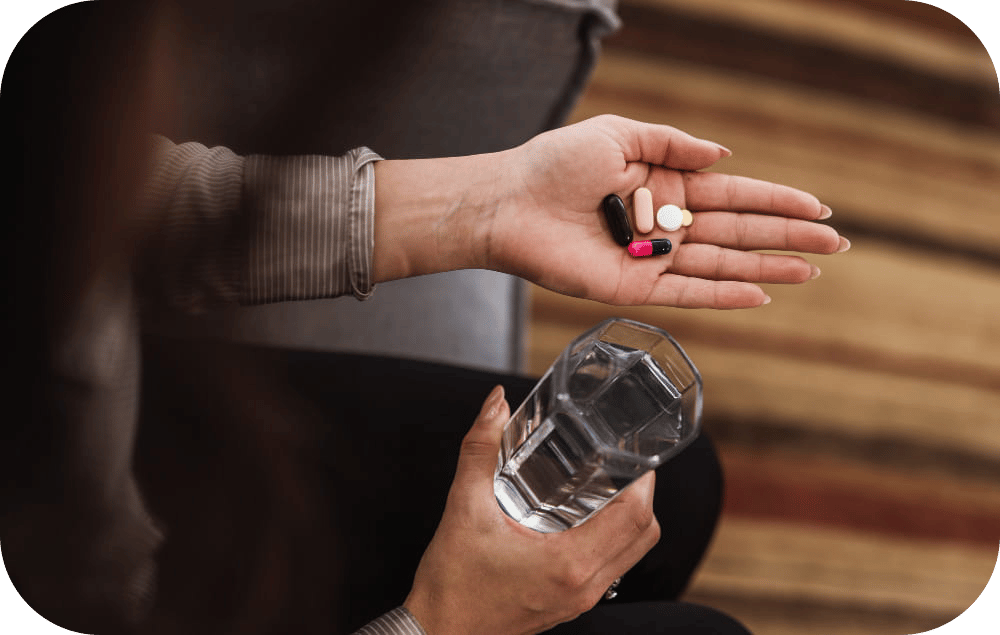 Woman holding pills