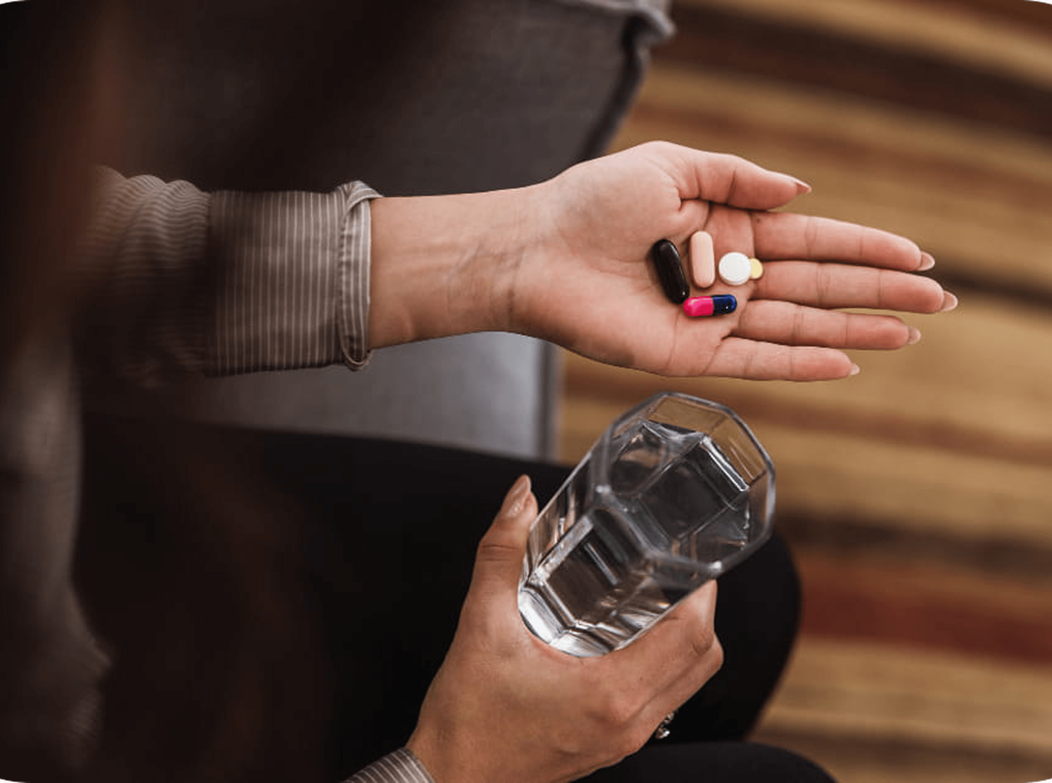 woman holding pills
