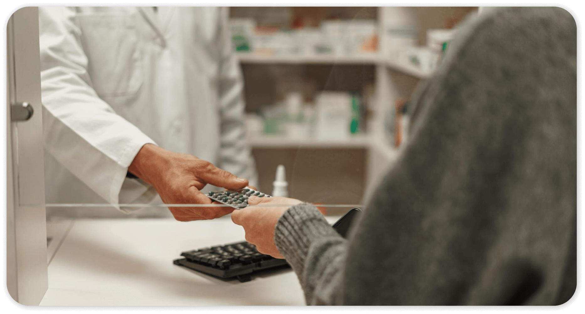 Customer using coupon for medication at pharmacy